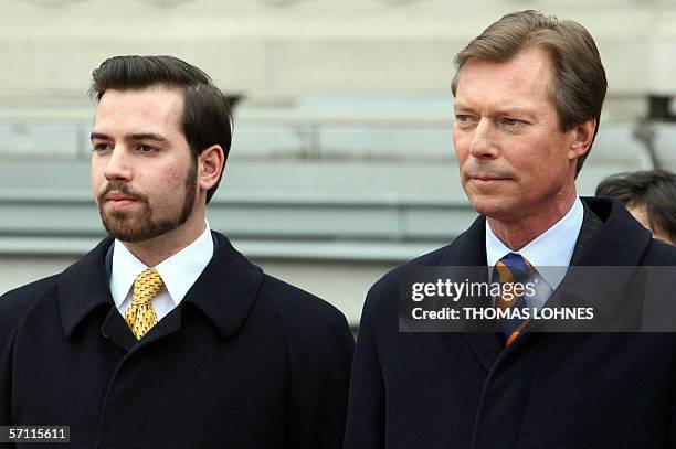 Henri I, Luxemburg's Grand Duke and his son Crown Prince Guillaume stand to attention during a welcoming ceremony in Wiesbaden 17 March 2006. Henri...