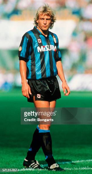 Juergen Klinsmann of Inter looks on during the Serie A match between AC Milan and Inter Milan at the Guiseppe Meazza Stadium on March 01, 1990 in...