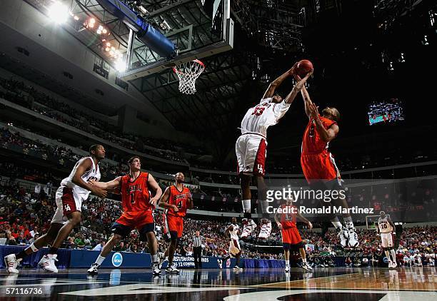 Vincent Hunter of the Arkansas Razorbacks is blocked by Charles Lee of the Bucknell Bison during the First Round of the 2006 NCAA Division 1 Men's...