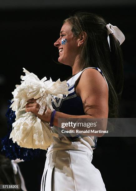 Memphis Tigers cheerleader leads the crowd in a cheer against Oral Roberts Golden Eagles during the First Round game of the 2006 NCAA Division 1...