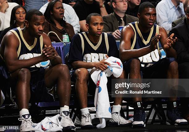 The Oral Roberts Golden Eagles sit dejected on the bench in the final minutes of the game against the Memphis Tigers during the First Round of the...