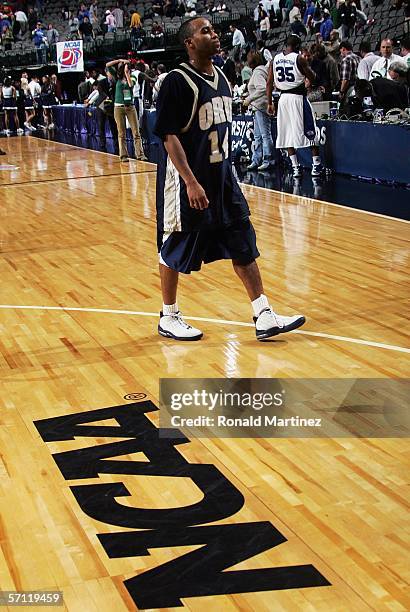 Jonathan Bluitt of the Oral Roberts Golden Eagles walks off the court after his team was defeated by the Memphis Tigers in the First Round game of...