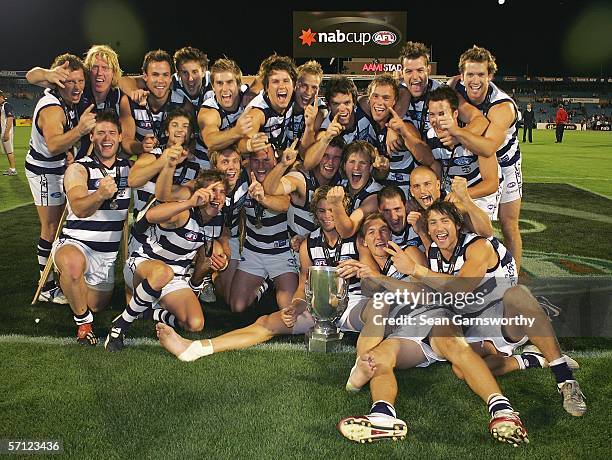 The Geelong team celebrate after winning the NAB Cup Grand Final between the Adelaide Crows and Geelong Cats at Adelaide Oval March 18, 2006 in...