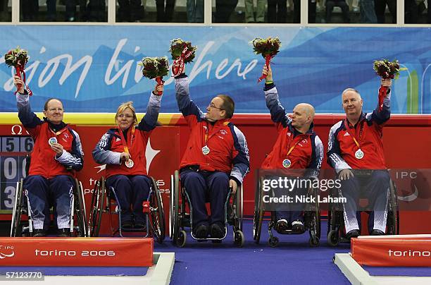 Ken Dickson, Angie Malone, Tom Killin, Michael McCreadie and Frank Duffy celebrate winning the Silver Medal after the Wheelchair Curling Final...