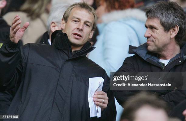 Juergen Klinsmann , headcoach of the German National Team, talks with Ulli Voigt , Media Director of the DFB, during the Bundesliga match between...