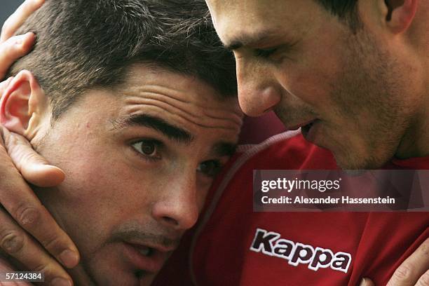 Ervin Skela of Kaiserslautern celebrates scoring the second goal with his team mate Mathieu Beda during the Bundesliga match between Borussia...