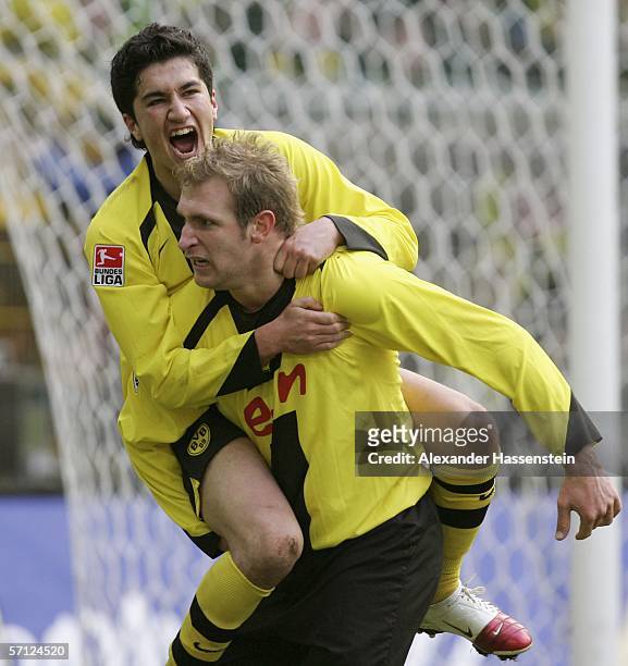Florian Kringe of Dortmund celebrates scoring the 3rd goal with his team mate Nuri Sahin during the Bundesliga match between Borussia Dortmund and...
