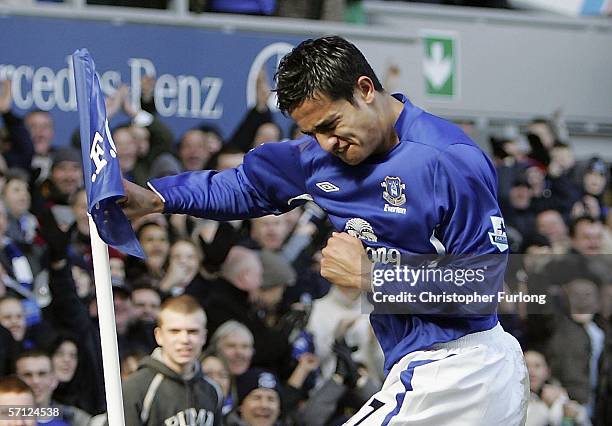 Tim Cahill of Everton celebrates scoring his first goal by boxing the corner flag during the Barclays Premiership match between Everton and Aston...