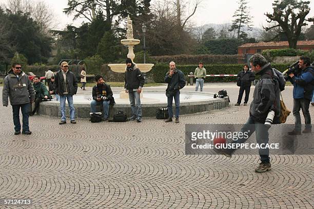 Photographers and cameramen play football on the main square in Cernobbio, 18 March 2006. US film stars Brad Pitt and Angelina Jolie are rumored to...