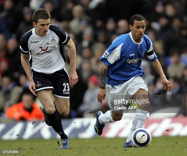 Birmingham, UNITED KINGDOM: Birmingham City's DJ Campbell leaves Tottenham's Michael Carrick trailing as he goes on the attack during their English...