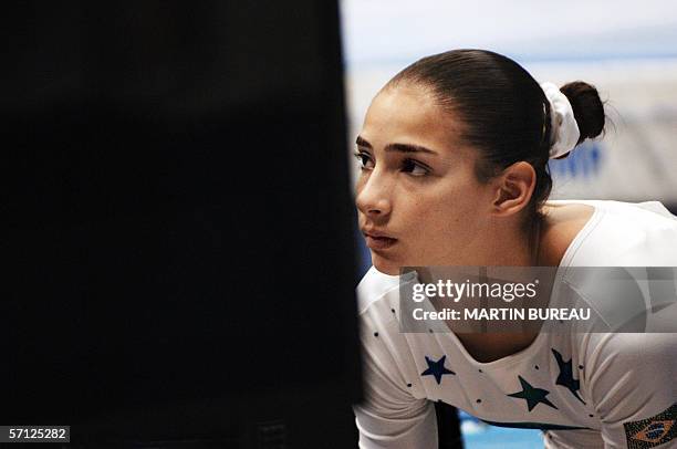 Brazil's Lais Souza concentrates before performing during the floor exercise qualifying round, 18 March 2006 in Lyon, central eastern France, during...