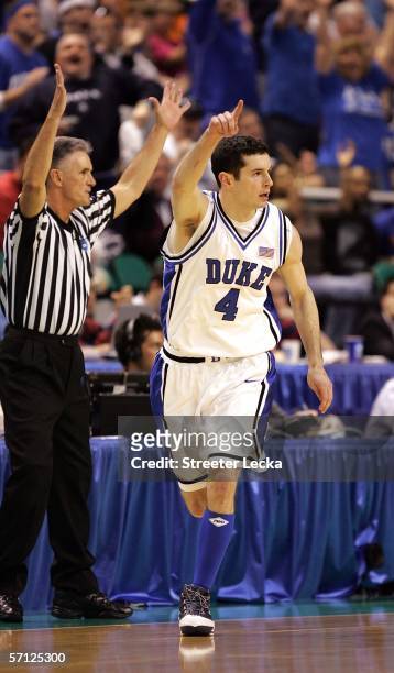 Redick of the Duke Blue Devils gestures after making a 3-pointer as he runs back down the floor in the first half against the George Washington...