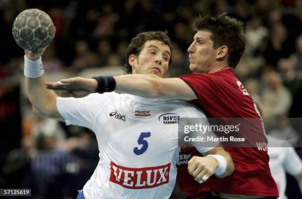 Daniel Kubes of Luebbecke tries to stop Torsten Jansen of Hamburg during the Bundesliga match between HSV handball and TUS-N-Lubbecke at the Color...