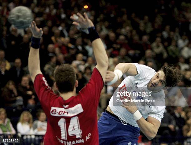 Bertrand Gille of Hamburg throws at goal during the Bundesliga match between HSV handball and TUS-N-Lubbecke at the Color Line Arena on march 18,...