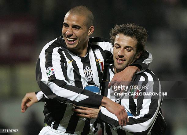 Juventus' forward David Trezeguet of France celebrates with his teammate forward and captain Alex Del Piero after scoring a goal during the italian...
