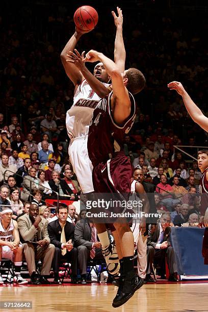 Craig Smith of the Boston College Eagles drives for a shot attempt against Andrew Strait of the Montana Grizzlies during the Second Round of the 2006...