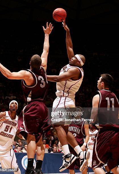 Craig Smith of the Boston College Eagles attempts a shot against Andrew Strait of the Montana Grizzlies during the Second Round of the 2006 NCAA...