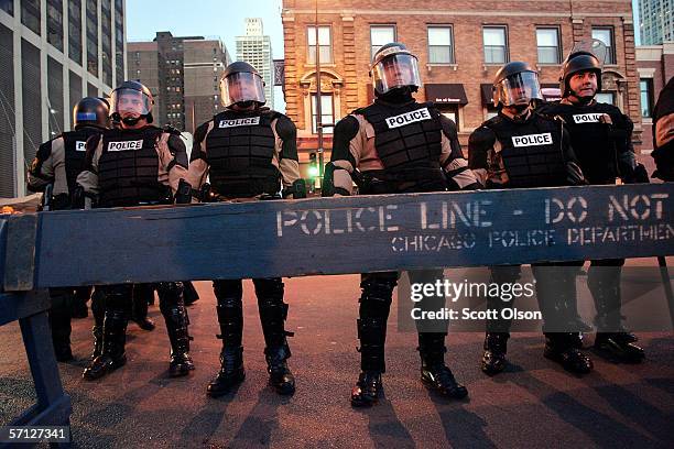 Illinois State Police prepare to follow an anti-war march marking the third anniversary of the invasion of Iraq March 18, 2006 in Chicago, Illinois....