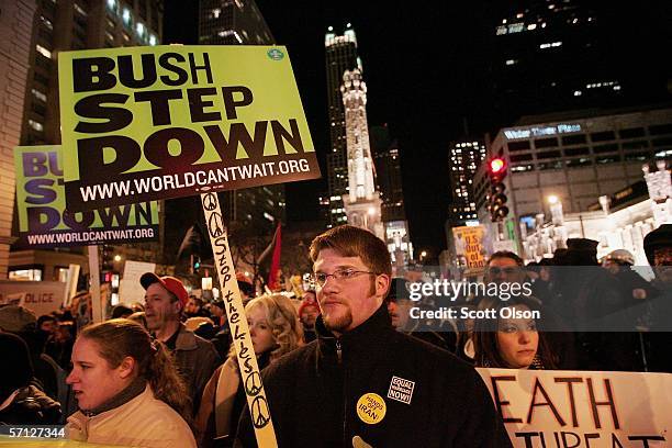 Protestors march down Michigan Avenue during an anti-war demonstration marking the third anniversary of the invasion of Iraq March 18, 2006 in...