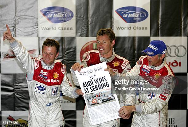 Allan McNish, Tom Kristensen and Ronaldo Capello celebrate on the podium after winning the 54th Annual Mobil 1 Twelve Hours of Sebring on March 18,...