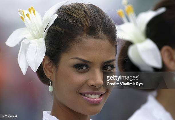 Grid girl smiles prior to the Malaysian Formula One Grand Prix on March 19 in Kuala Lumpur, Malaysia.