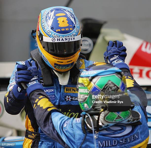 Giancarlo Fisichella of Italy finishing 1st and his team mate Fernando Alonso of Spain and Renault finishing 2nd celebrate after the Malaysian...