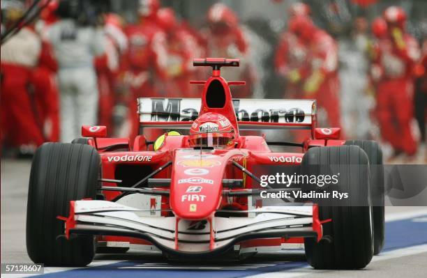 Michael Schumacher of Germany and Ferrari drives on the pit lane after pit stop during the Malaysian Formula One Grand Prix on March 19 in Kuala...