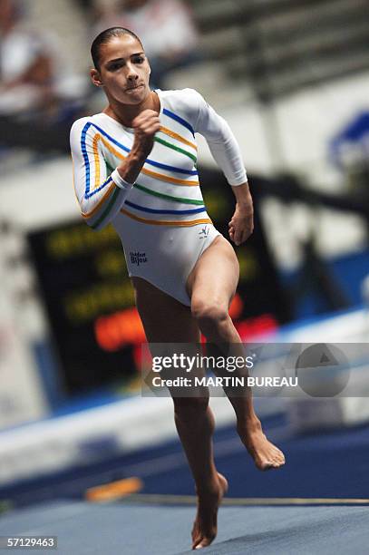 Brazil's Lais Souza performs during the vault final round, 19 March 2006 in Lyon, central eastern France, during the 15th International Championships...
