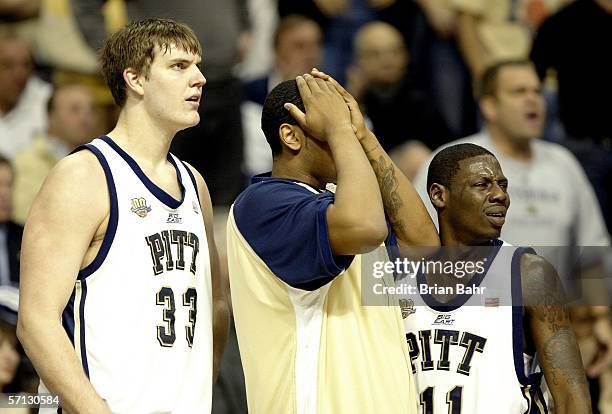Aaron Gray and Carl Krauser of the Pittsburgh Panthers look on from the sidelines during the Second Round of the 2006 NCAA Men's Basketball...