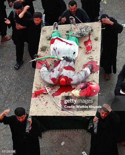 Iraqi Shiites re-enact the battle of Karbala on March 19, 2006 in the holy Shiite city of Karbala 70 miles south of Baghdad, Iraq. A mortar shell...