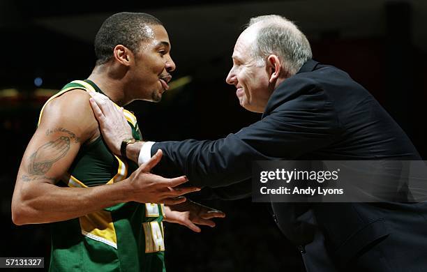 Lamar Butler of the George Mason Patriots celebrates with Coach Jim Larranaga during the game against the North Carolina Tar Heels in the Second...