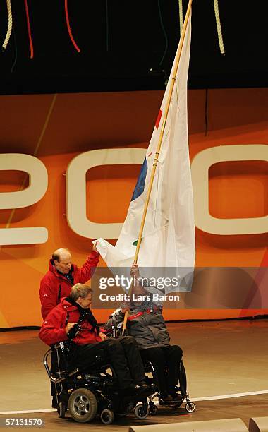 The Paralympic flag is passed by Phil Craven of the International Paralympic Committee to a representative of the Vancouver 2010 games during the...