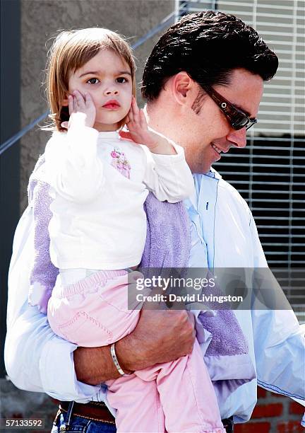 Football player Jason Sehorn with one of his daughters attends the John Varvatos 4th Annual Stuart House Benefit at the John Varvatos Boutique on...