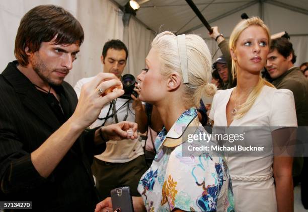 Socialite Paris Hilton and sister Nicky Hilton backstage at the Louis Verdad Fall 2006 show during Mercedes-Benz Fashion Week at Smashbox Studios on...