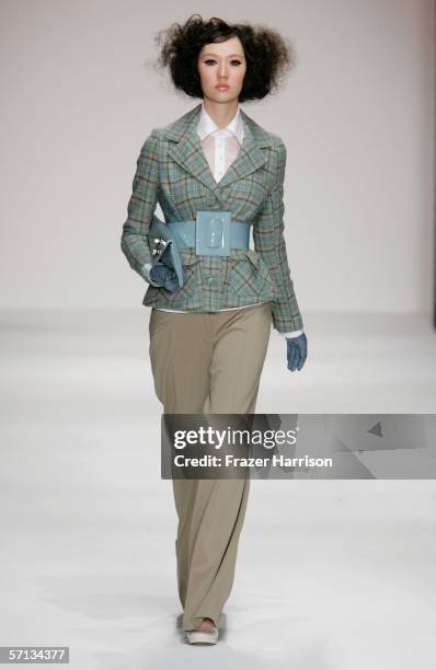 Model walks the runway at the Louis Verdad Fall 2006 show during Mercedes-Benz Fashion Week at Smashbox Studios on March 19, 2006 in Culver City,...