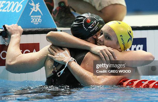 Joanna Fargus of Australia is congratulated by second-placed Melanie Marshall of England after her victory in the women's 200-metres backstroke final...