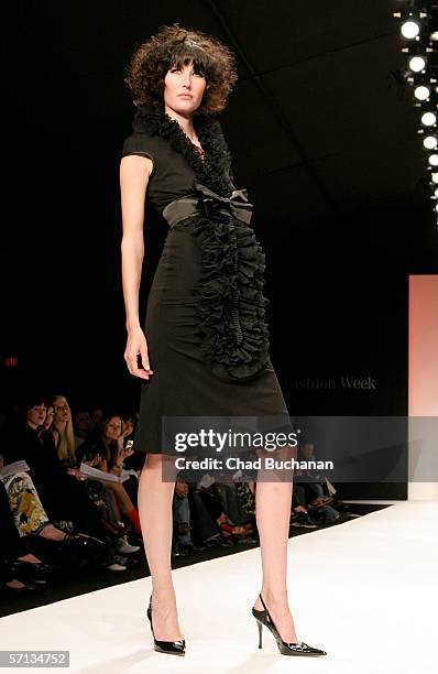 Model walks the runway at the Louis Verdad Fall 2006 show during Mercedes-Benz Fashion Week at Smashbox Studios on March 19, 2006 in Culver City,...