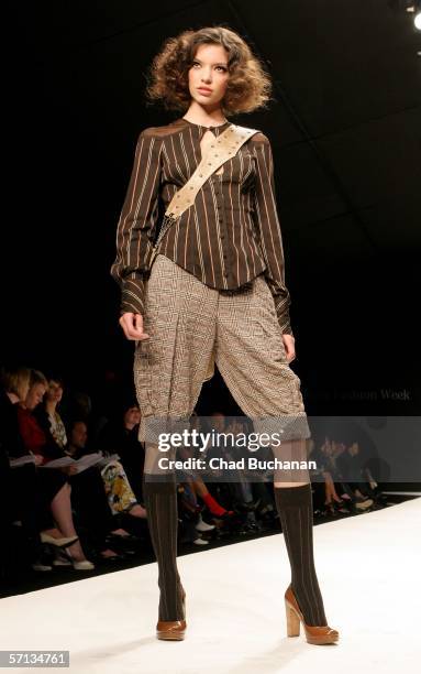 Model walks the runway at the Louis Verdad Fall 2006 show during Mercedes-Benz Fashion Week at Smashbox Studios on March 19, 2006 in Culver City,...