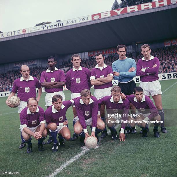 Squad and team members of Belgian football club RSC Anderlecht, league champions of 1966-67, posed together at a football ground in Brussels, Belgium...