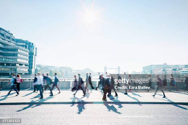 workers walking to work through the city. - walking foto e immagini stock