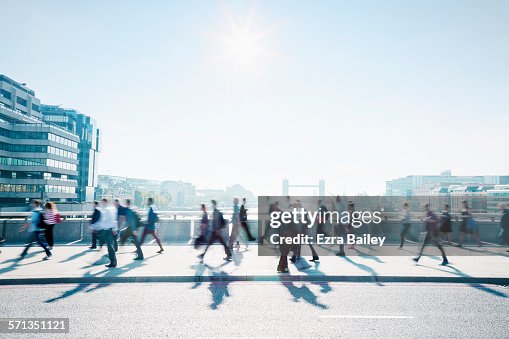 Workers walking to work through the city. Workers walking to work through the city.