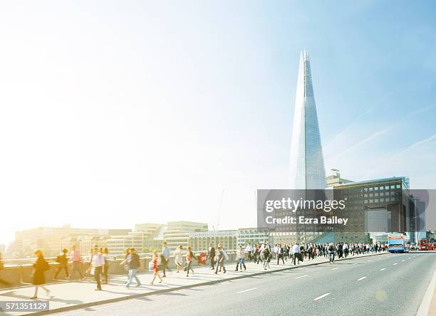 walking to work through the city at sunrise - views of london from the shard tower stock-fotos und bilder