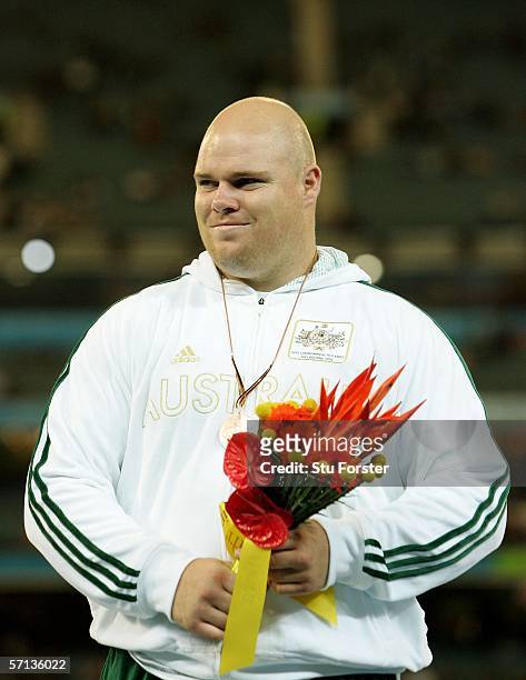 Scott Martin of Australia pose with his Bronze medal from the Men's Shot Put at the athletics during day five of the Melbourne 2006 Commonwealth...
