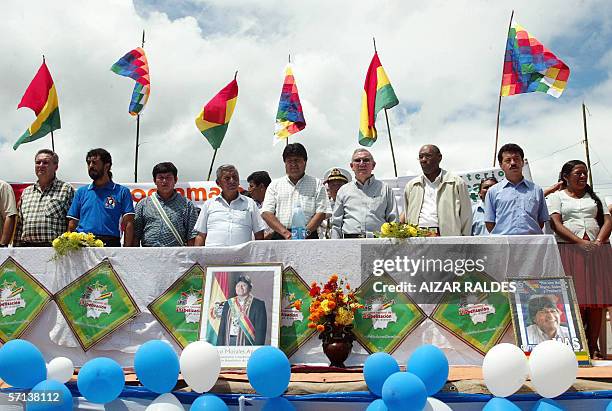Bolivia's President Evo Morales sings his national anthem next to Cuban Minister of Education Luis Ignacio Gomez and Venezuelan Minister of...