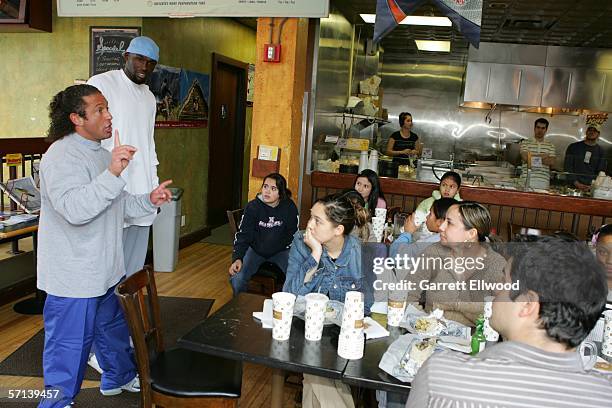 Reggie Evans and strength and conditioning coach Steve Hess of the Denver Nuggets join students from Columbine Elementary to make burritos at Illegal...