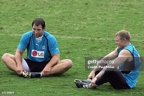 Ben Ross and Darren Albert of the Cronulla Sharks stretch during a training session at Toyota Park on March 21, 2006 in Sydney, Australia.