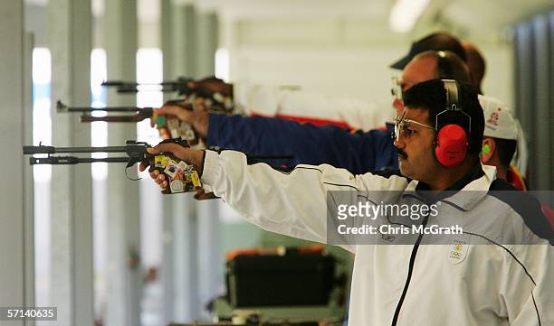 Samaresh Jung of India takes aim during the Men's 50m pistol Final at the Melbourne International Shooting Club during day six of the Melbourne 2006...