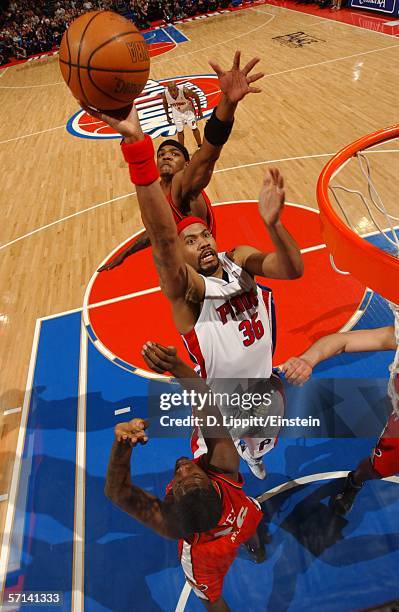 Rasheed Wallace of the Detroit Pistons attempts a dunk against Royal Ivey and Josh Smith of the Atlanta Hawks in NBA action March 20, 2006 at the...