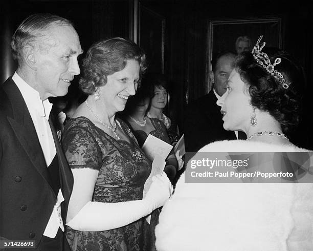 Queen Elizabeth II meets former Prime Minister Sir Alec Douglas-Home and Lady Home at County Hall in London, 11th November 1964. The Douglas-Homes...