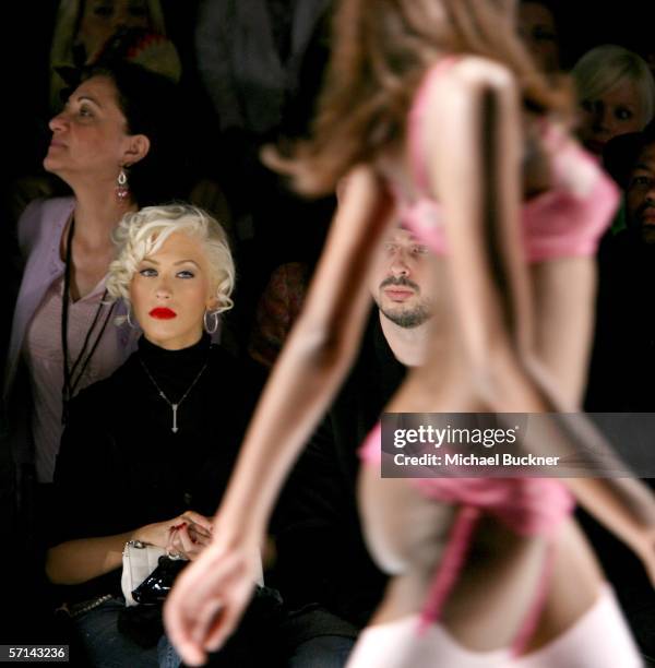 Singer Christina Aguilera and husband Jordan Bratman in the front row at the Agent Provocateur Fall 2006 show during Mercedes-Benz Fashion Week at...